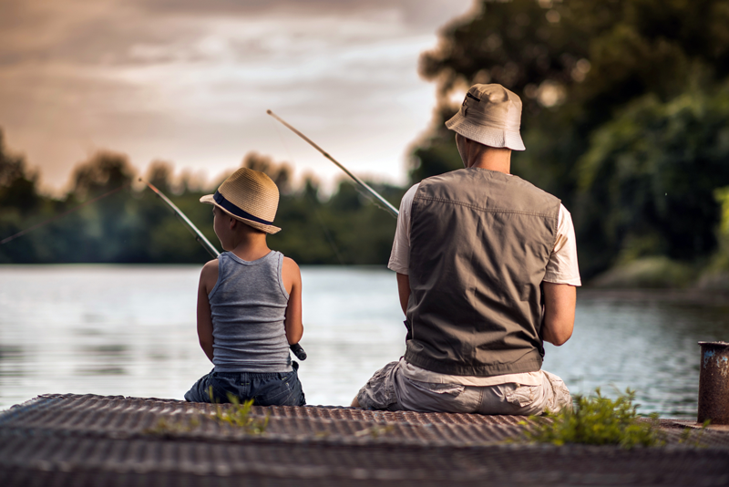 Matthew Davies image of a father and son fishing off a dock