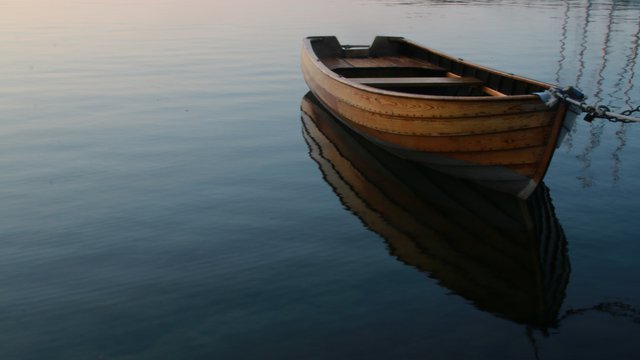 Matthew Davies image of a wood boat on the water
