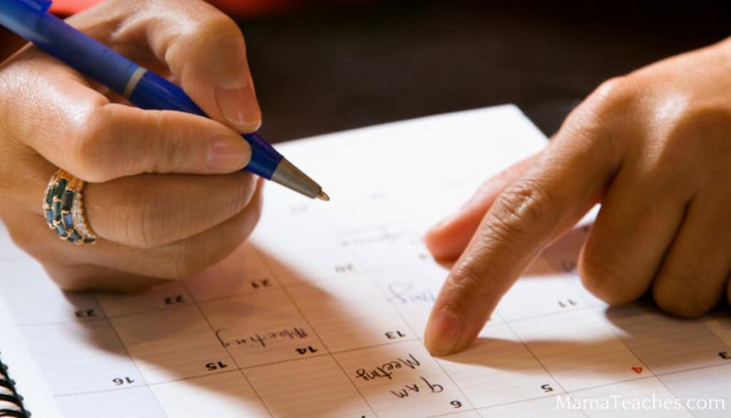 Matthew Davies image of a person writing in a daily planner.