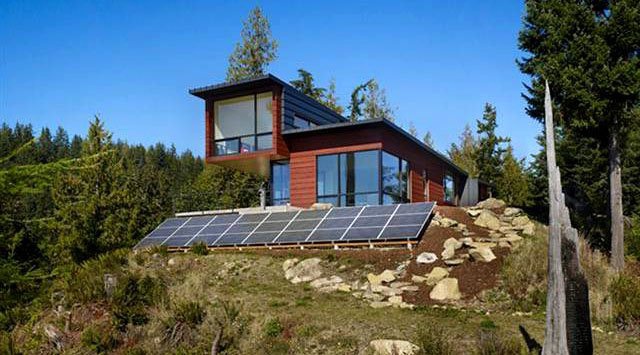 Matthew Davies image of a home with solar panels for electricity and heat.